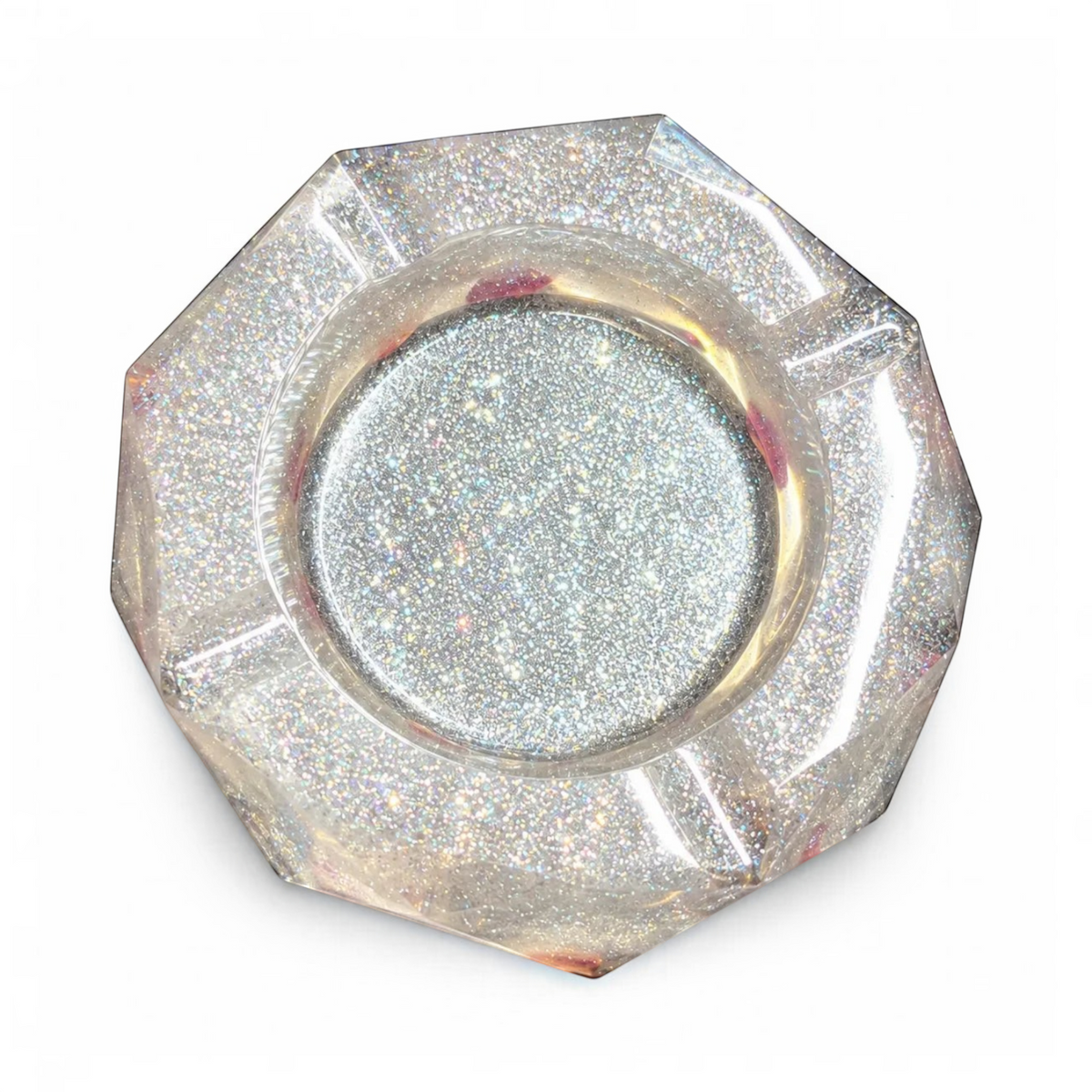 White Ashes Smoke Shop hexagonal resin ashtray with silver glitter and dried rose petals, top-down view.