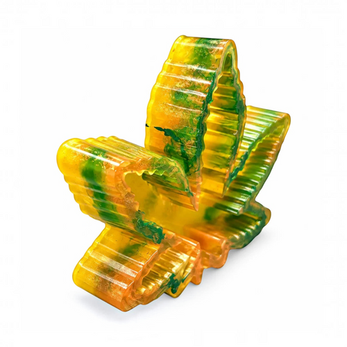White Ashes Smoke Shop leaf-shaped resin ashtray in vibrant green, orange, and gold with a high-gloss finish.