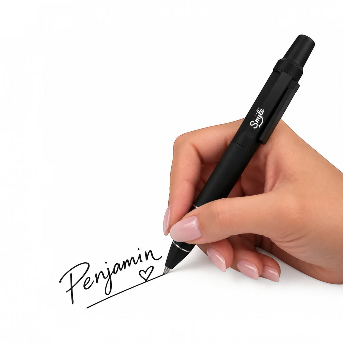 White Ashes Smoke Shop matte black Smyle retractable ballpoint pen being used to write on white paper