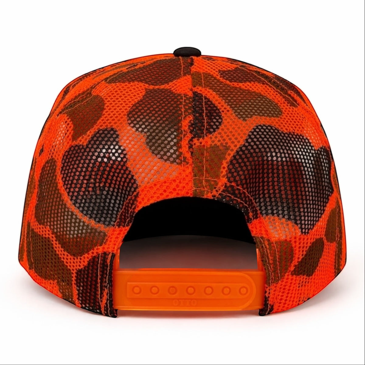 White Ashes Smoke Shop fire orange camo trucker hat with breathable mesh back and adjustable snapback closure.