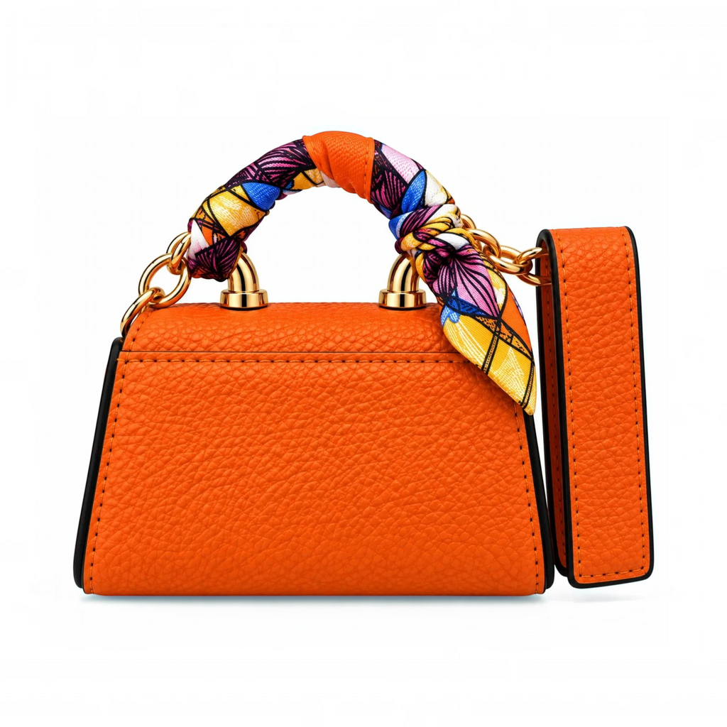 White Ashes Smoke Shop orange faux leather miniature handbag with a patterned silk-feel scarf handle and gold hardware.