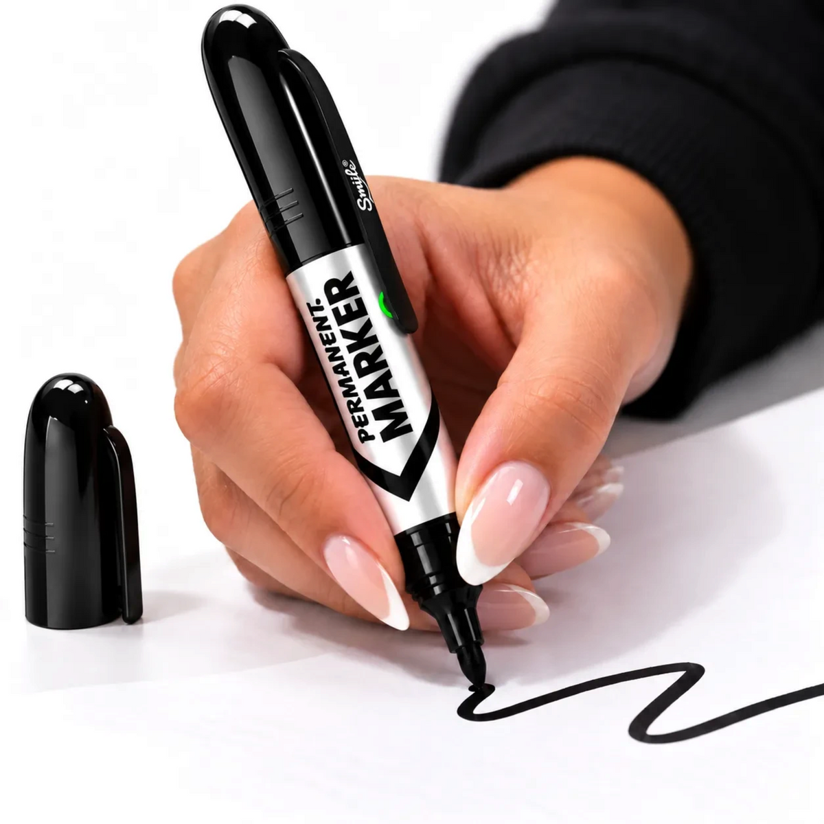 White Ashes Smoke Shop Smyle Labs Permanent Marker 510 battery pen writing on paper with removable cap nearby