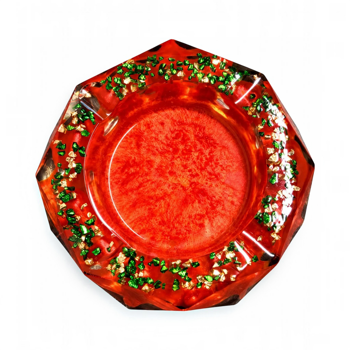White Ashes Smoke Shop octagonal red resin ashtray with shimmering green and gold flakes in a pearlescent finish.