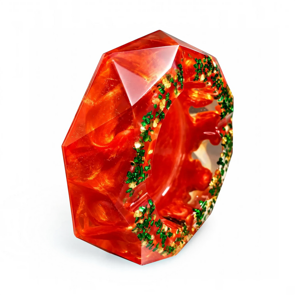 White Ashes Smoke Shop octagonal red resin ashtray with swirling pearlescent finish and green and gold flake accents.