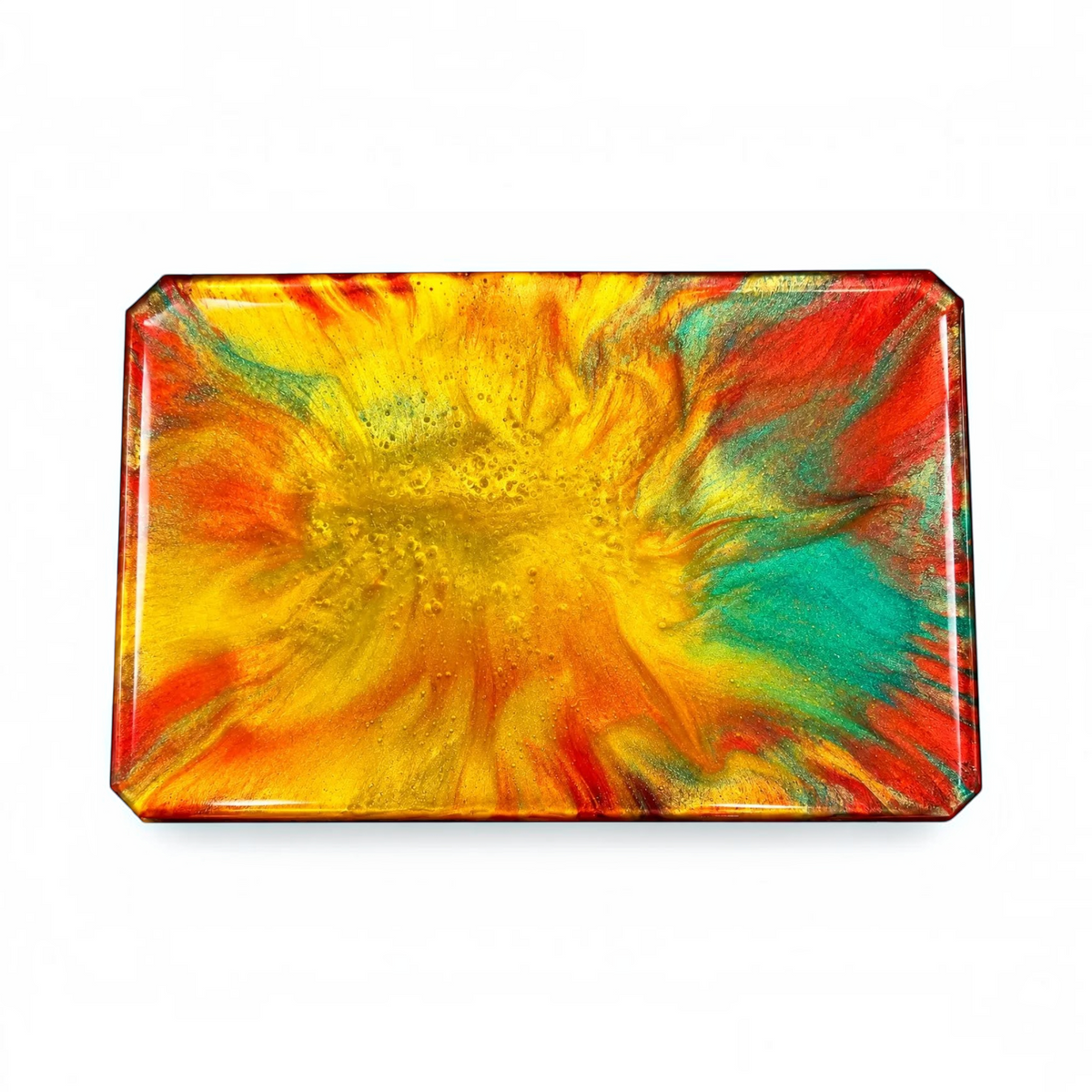 White Ashes Smoke Shop handcrafted resin rolling tray with a vibrant sunset swirl of red, yellow, and teal colors.