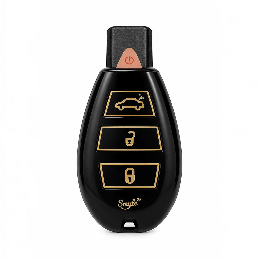 White Ashes Smoke Shop Smyle portable massager in high-gloss black with a car key fob design and gold accents.